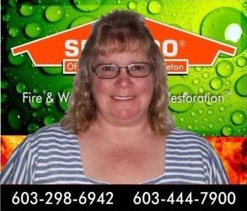head shot of woman in front of SERVPRO background