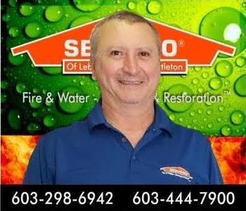 head shot of man in front of SERVPRO background