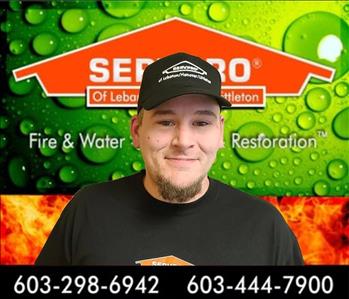 crew photo of man in front of servpro background