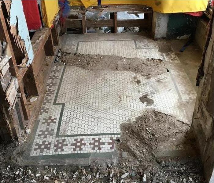damaged Commercial tile floor and walls