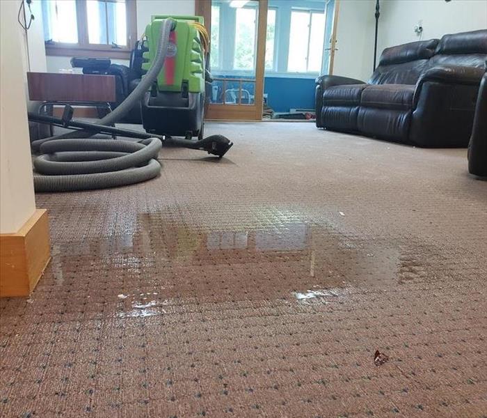picture of room and rug saturated with water