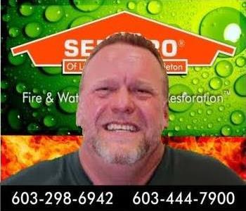 head shot of man in front of SERVPRO background